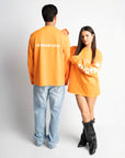 STUDIO ORANGE OVERSIZED LONGSLEEVE