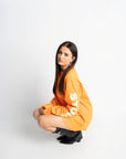 STUDIO ORANGE OVERSIZED LONGSLEEVE